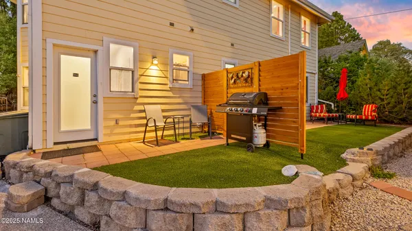 a kitchen with a table and chairs