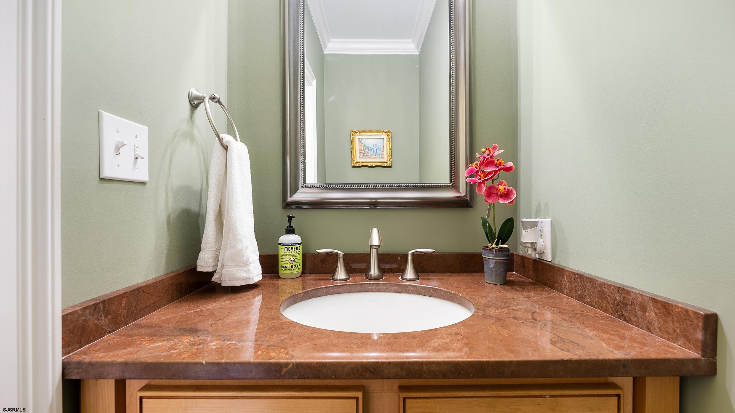 25 Brookside Drive Egg Harbor Township, NJ 08234 - Photo 11 of 47 a bathroom with a sink and a mirror