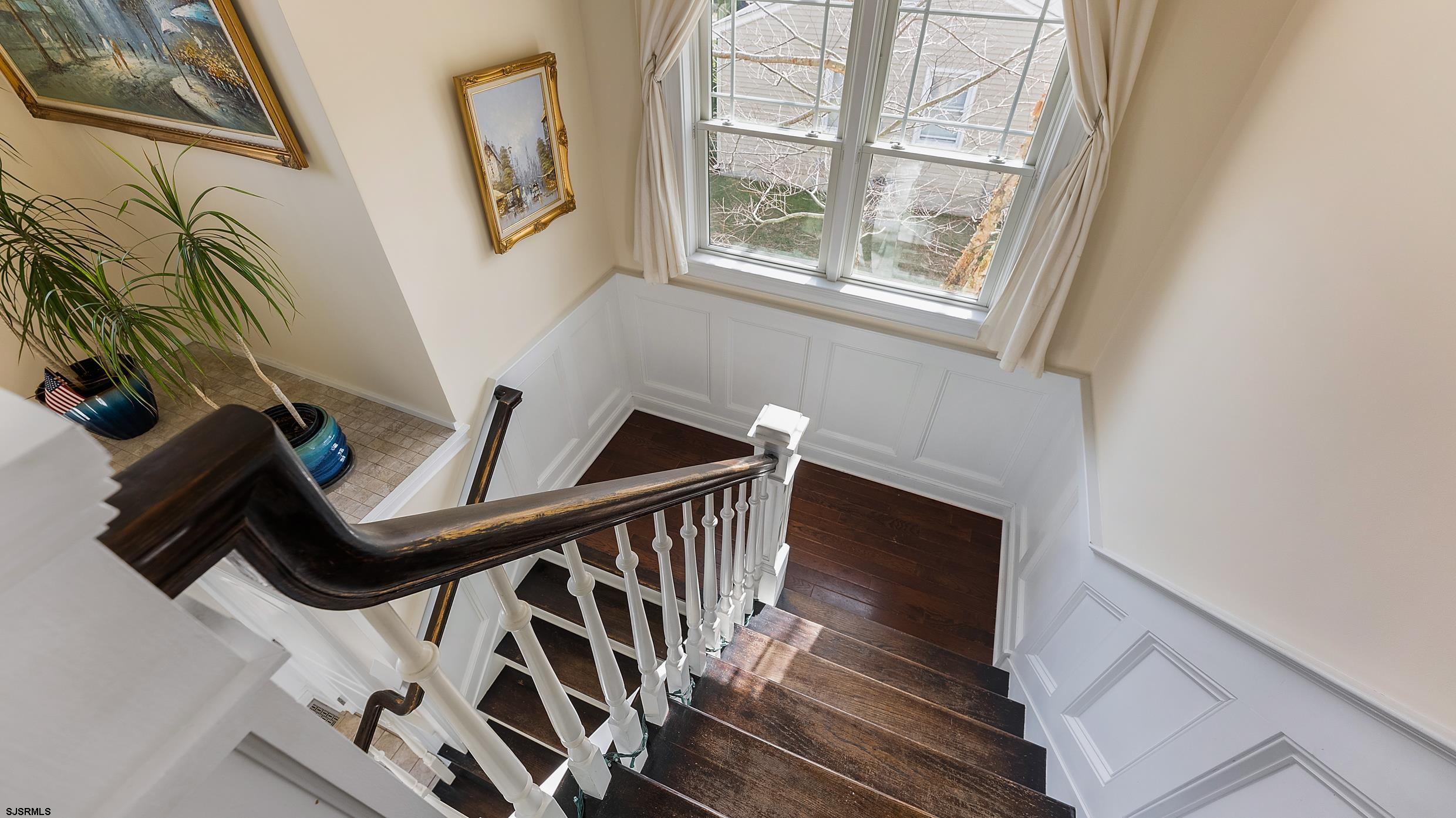 25 Brookside Drive Egg Harbor Township, NJ 08234 - Photo 13 of 47 a view of entryway with wooden floor and stairs