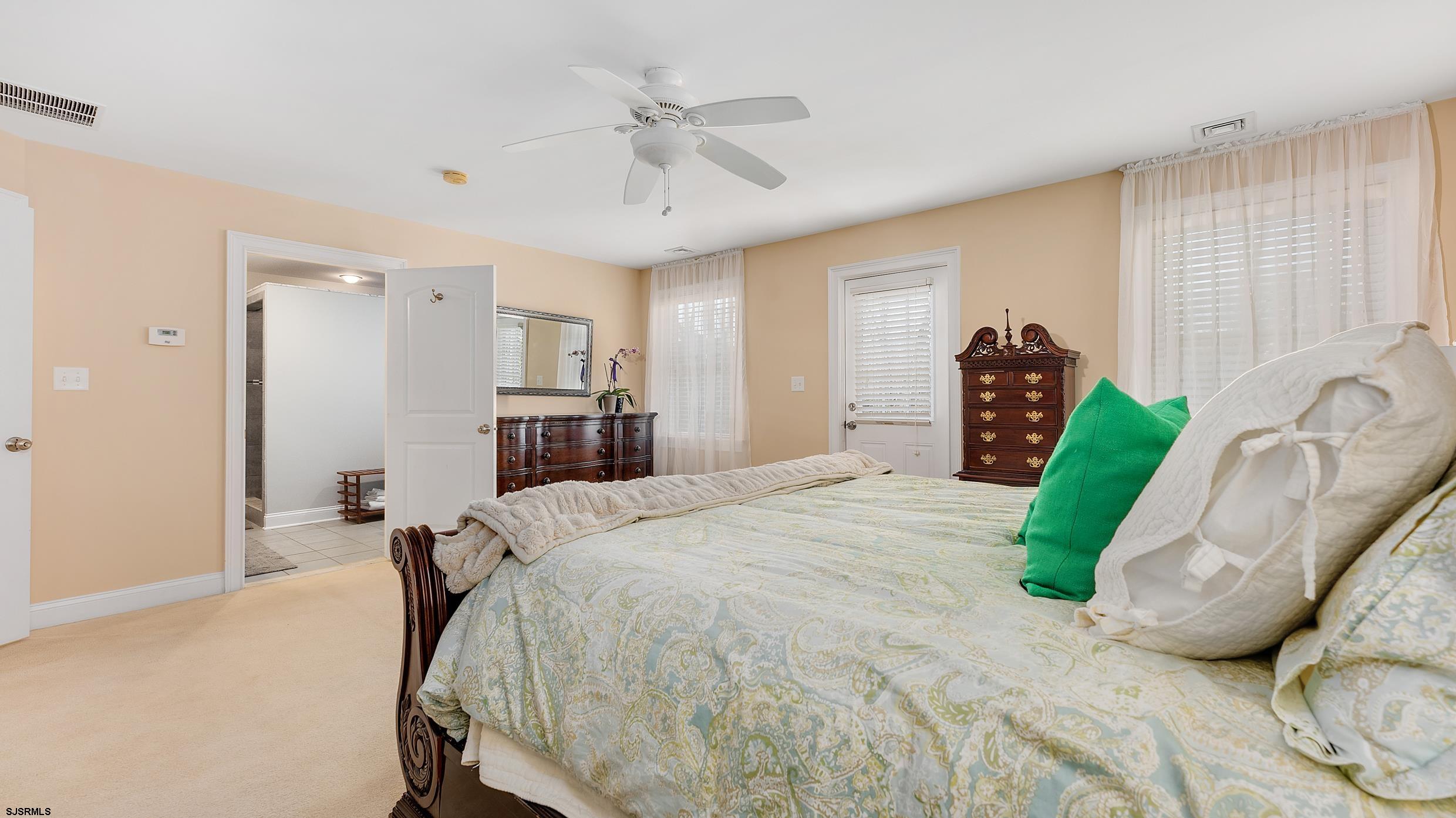 25 Brookside Drive Egg Harbor Township, NJ 08234 - Photo 18 of 47 a bedroom with a bed dresser and a window