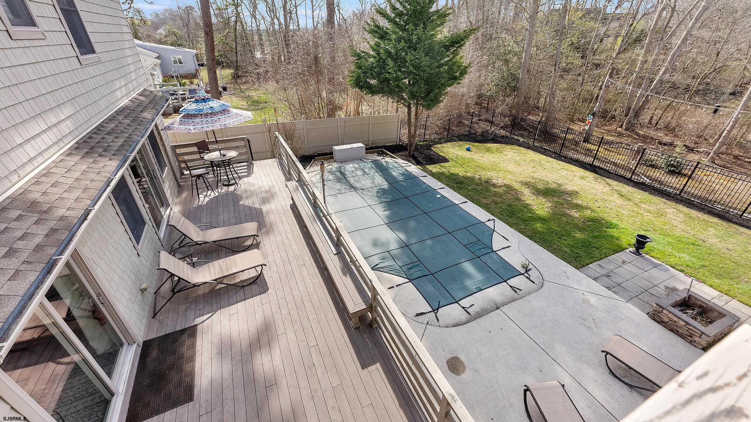 25 Brookside Drive Egg Harbor Township, NJ 08234 - Photo 24 of 47 a view of a balcony with two chairs