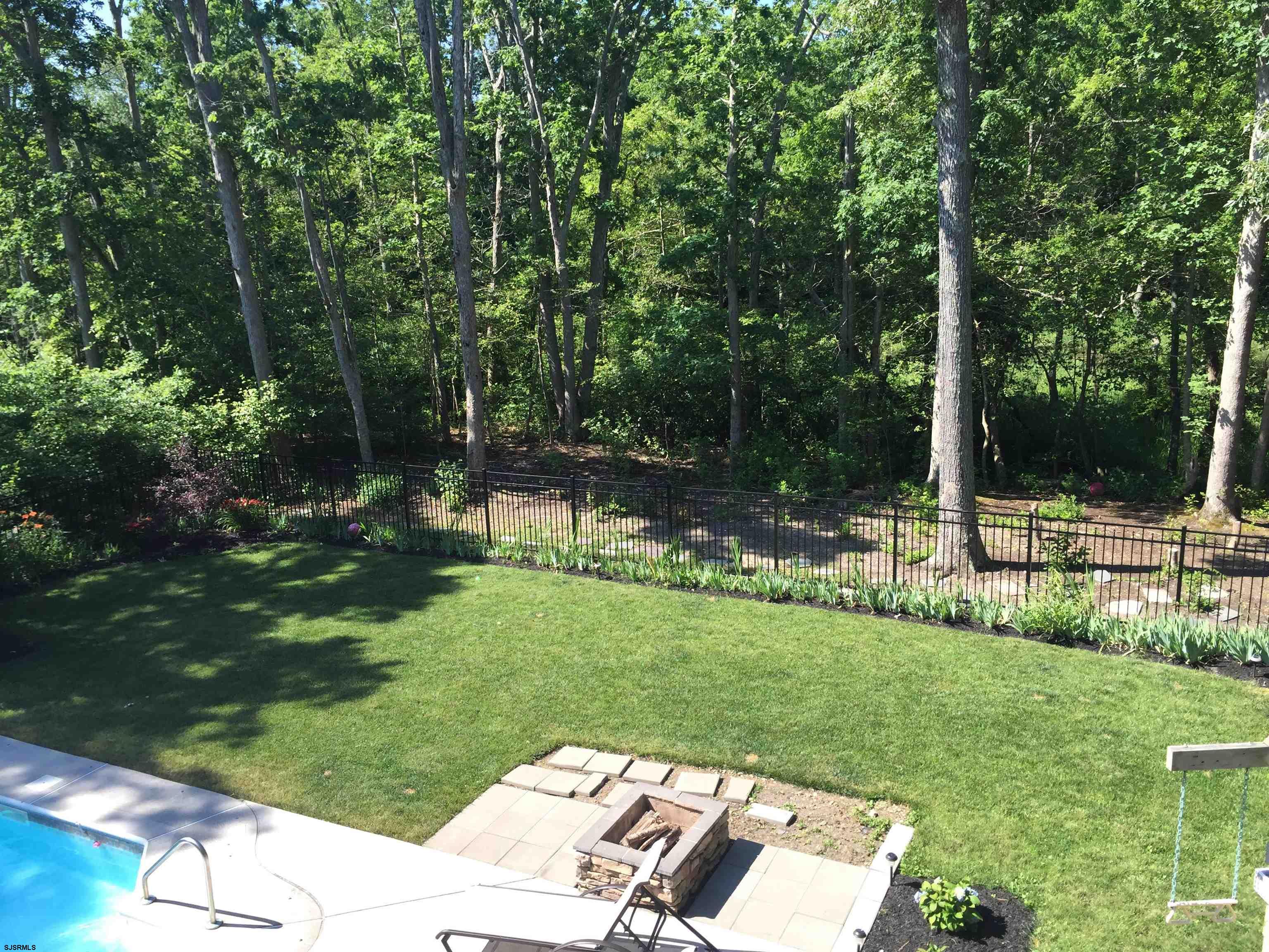 25 Brookside Drive Egg Harbor Township, NJ 08234 - Photo 25 of 47 a view of a backyard with sitting area