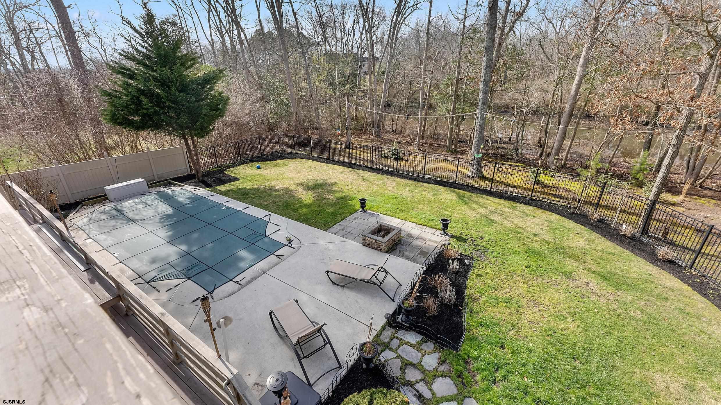 25 Brookside Drive Egg Harbor Township, NJ 08234 - Photo 26 of 47 a view of a swimming pool with a patio