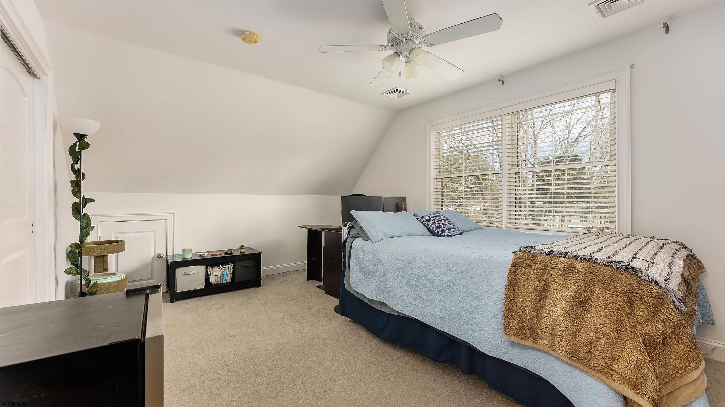 25 Brookside Drive Egg Harbor Township, NJ 08234 - Photo 28 of 47 a bedroom with bed and window