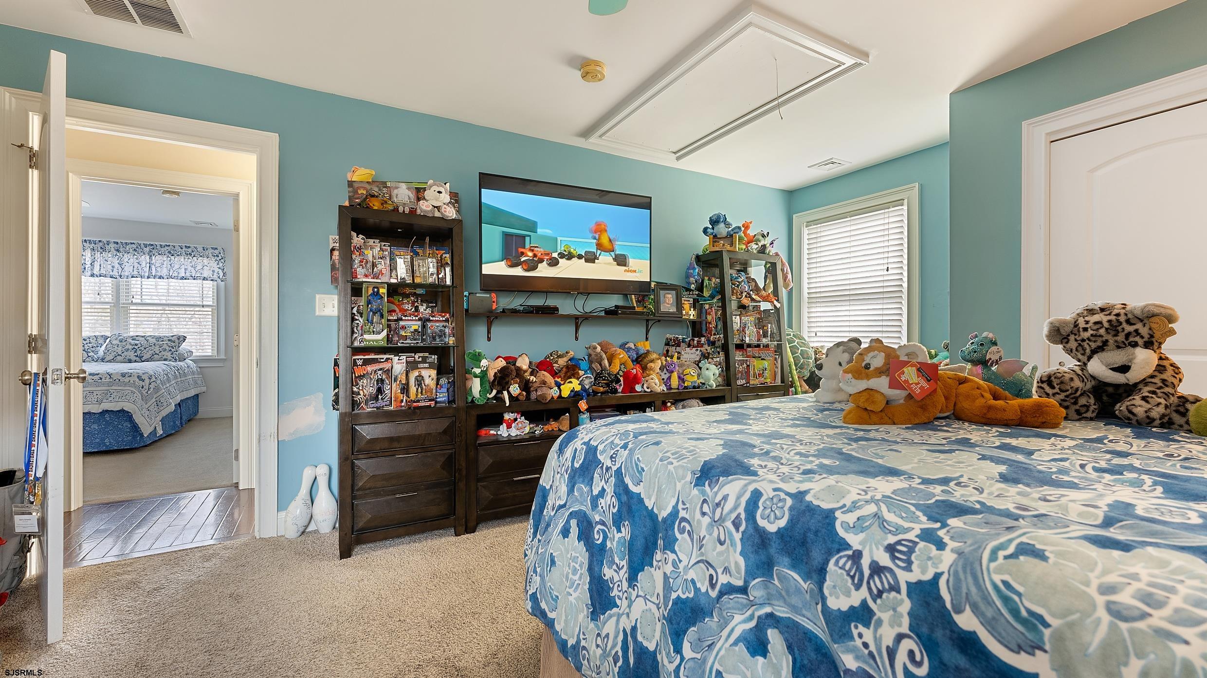 25 Brookside Drive Egg Harbor Township, NJ 08234 - Photo 29 of 47 a bed room with a bed and a walk in closet