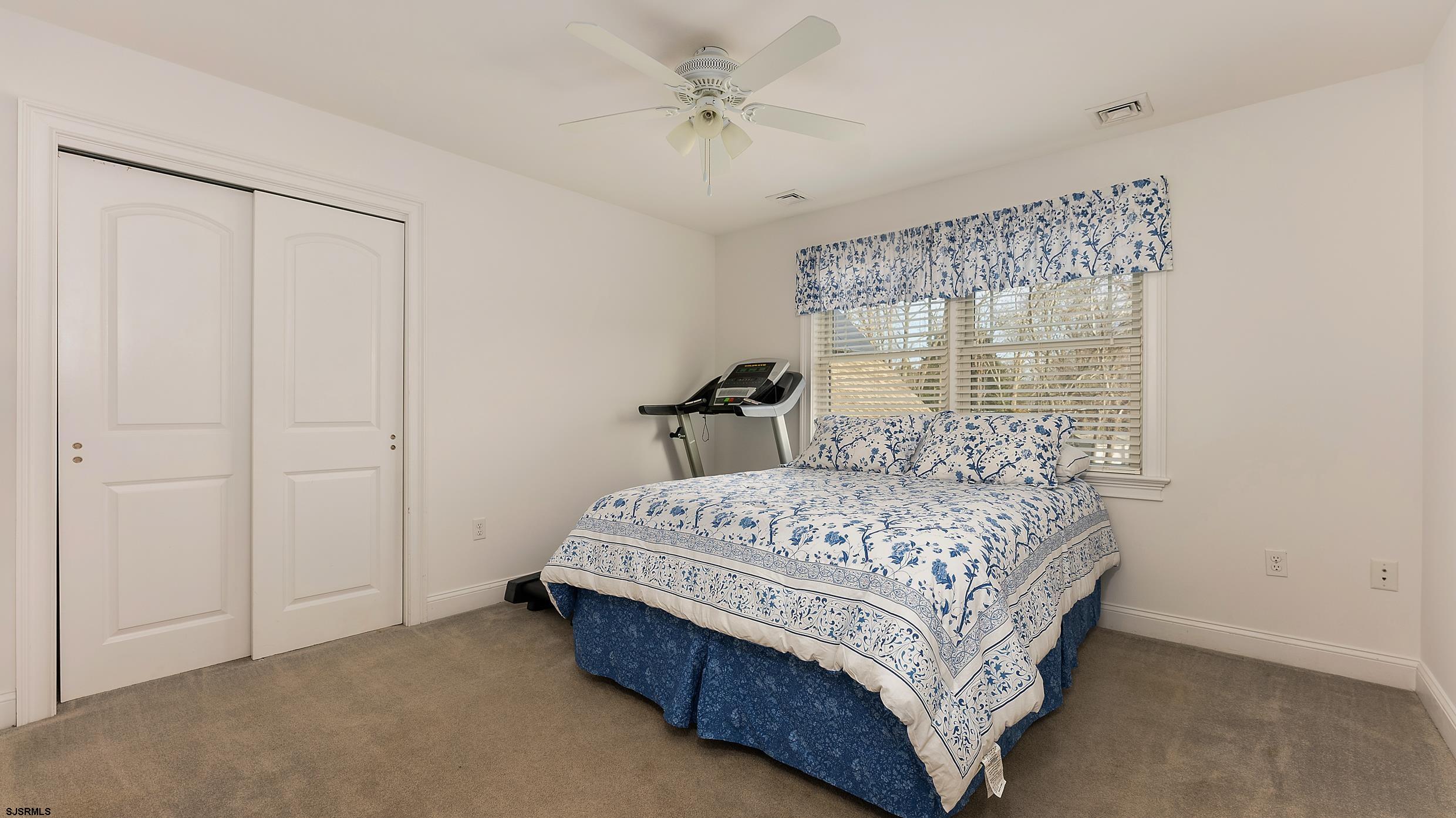 25 Brookside Drive Egg Harbor Township, NJ 08234 - Photo 30 of 47 a bedroom with a bed and a table