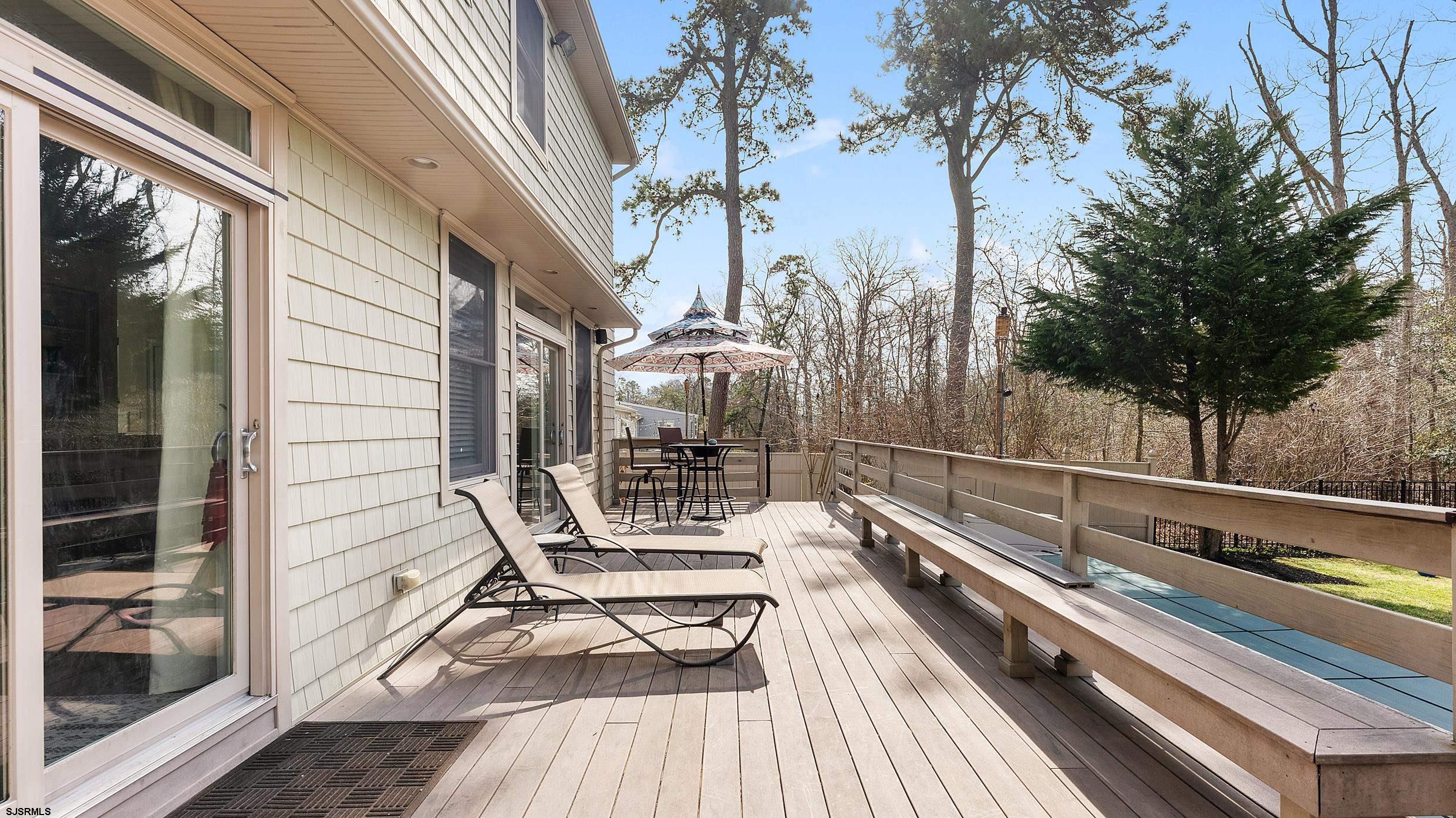 25 Brookside Drive Egg Harbor Township, NJ 08234 - Photo 32 of 47 a view of balcony with two chairs and wooden floor
