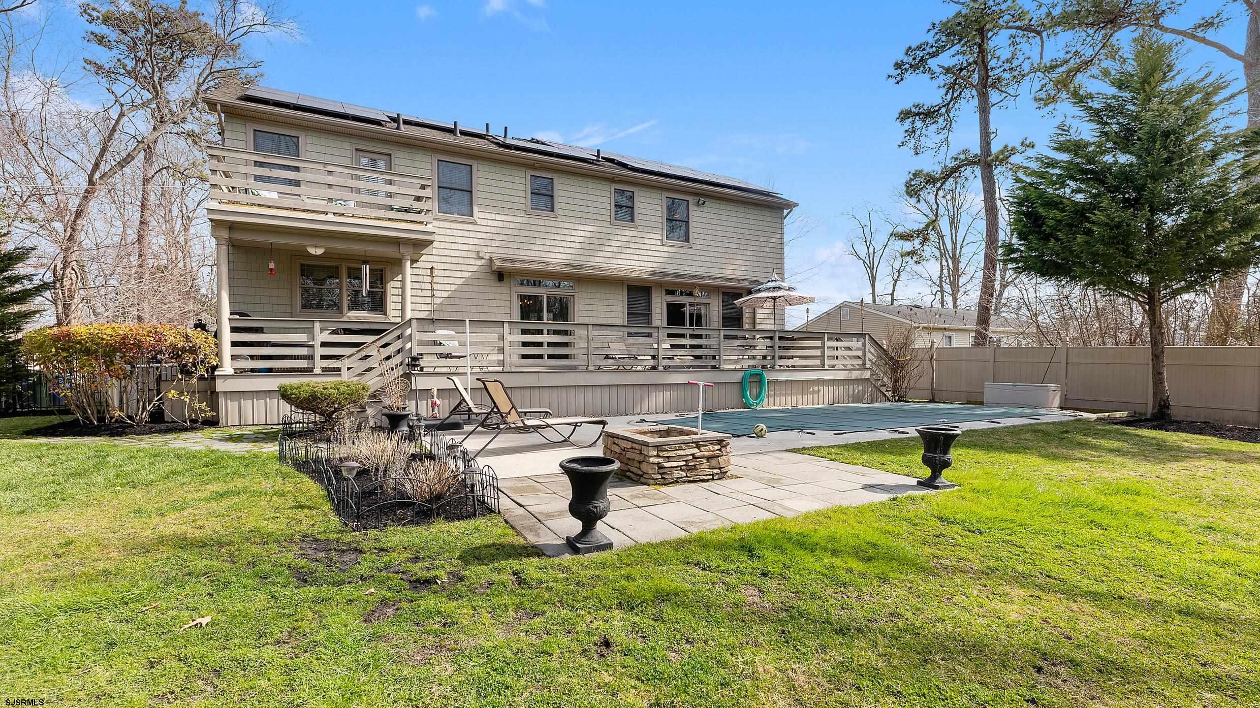 25 Brookside Drive Egg Harbor Township, NJ 08234 - Photo 42 of 47 a view of a house with swimming pool and sitting area
