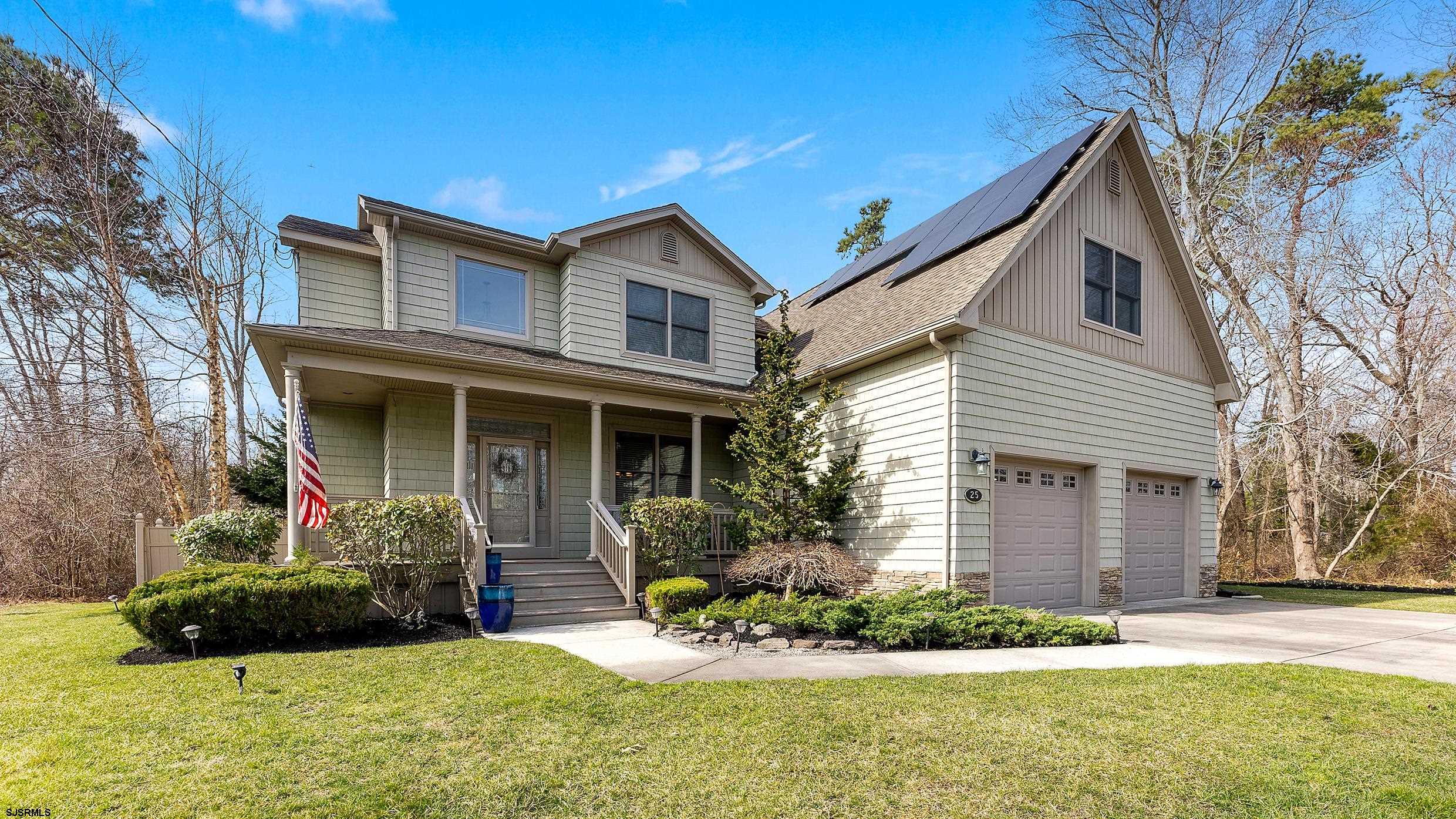 25 Brookside Drive Egg Harbor Township, NJ 08234 - Photo 46 of 47 a front view of a house with a yard and garage