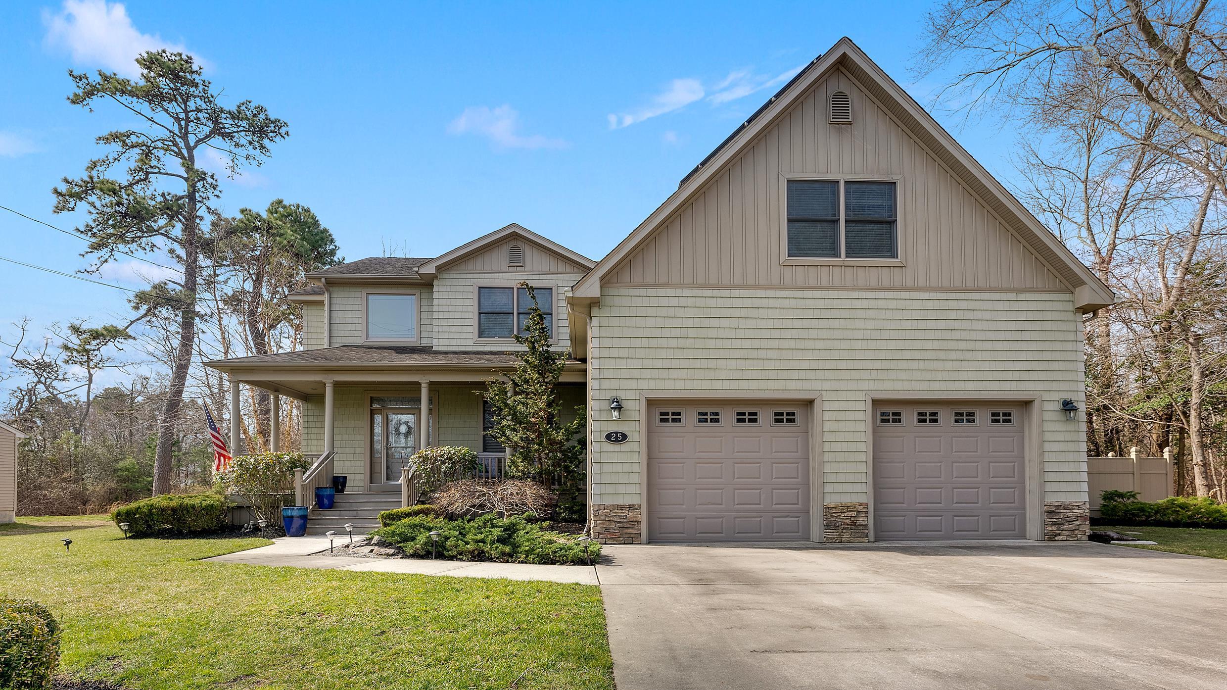 25 Brookside Drive Egg Harbor Township, NJ 08234 - Photo 47 of 47 a front view of a house with a yard and garage