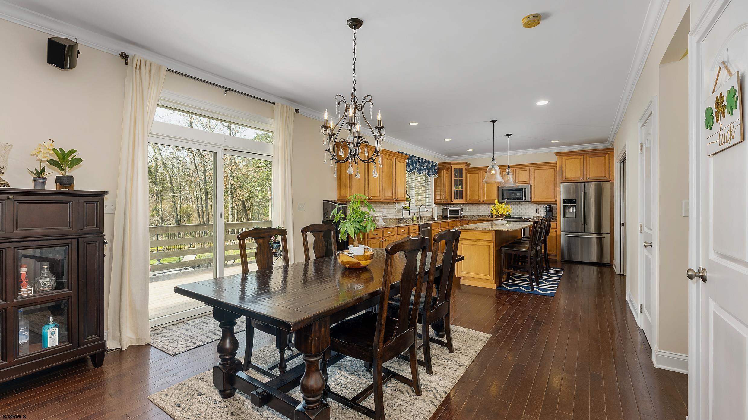 25 Brookside Drive Egg Harbor Township, NJ 08234 - Photo 5 of 47 a view of a dining room with furniture window and wooden floor