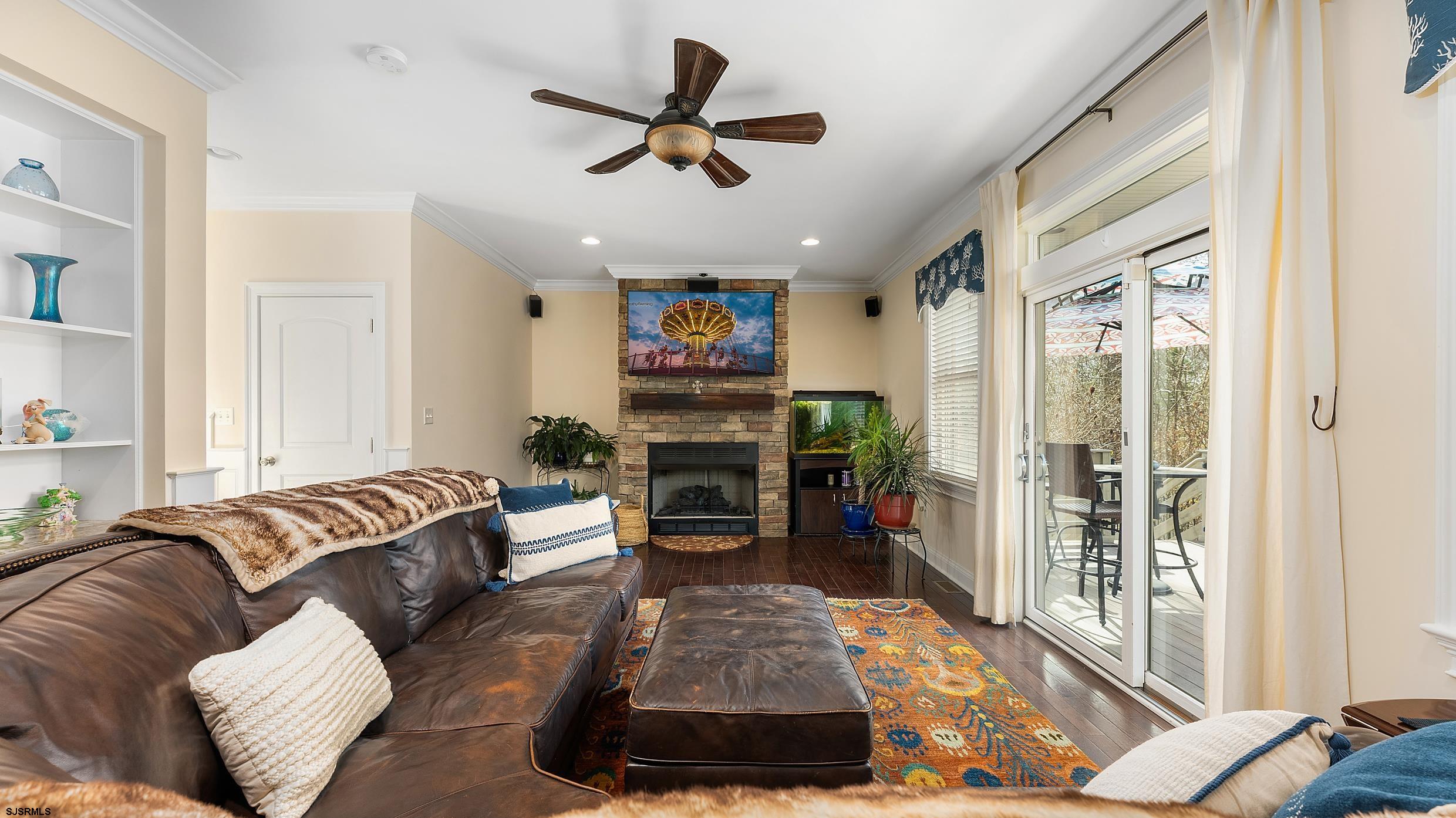 25 Brookside Drive Egg Harbor Township, NJ 08234 - Photo 7 of 47 a living room with furniture and a fireplace