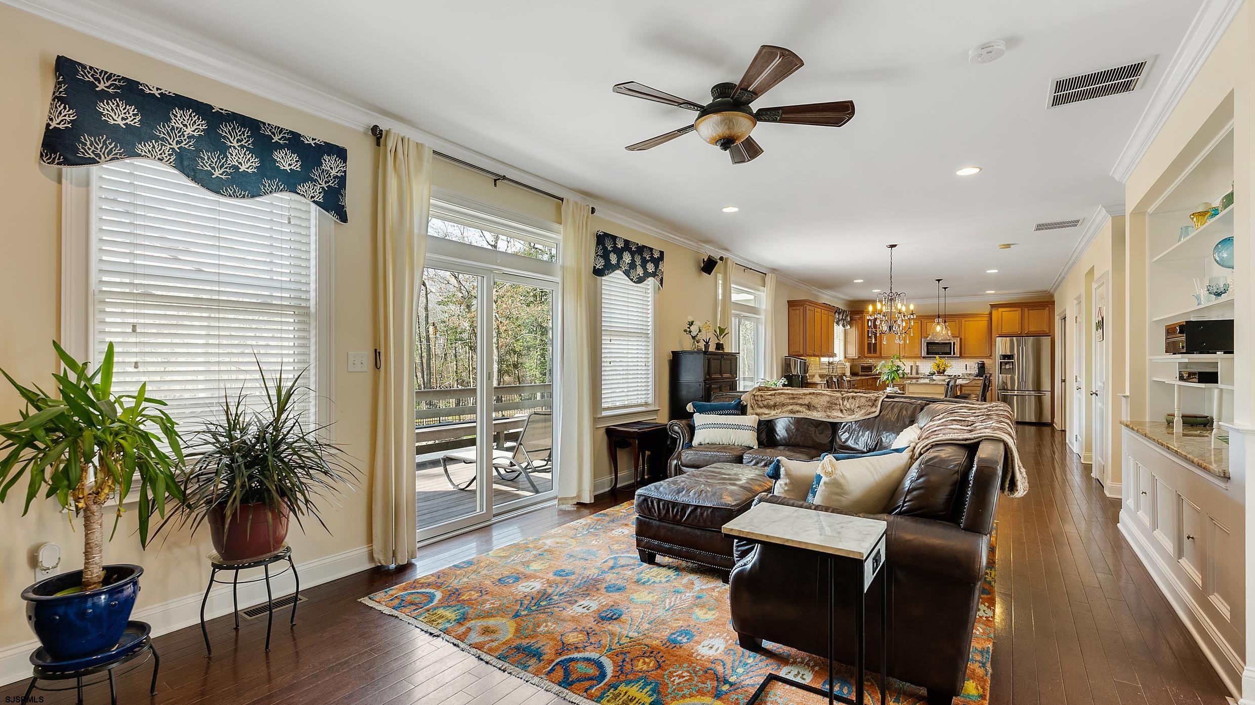 25 Brookside Drive Egg Harbor Township, NJ 08234 - Photo 8 of 47 a living room with furniture ceiling fan and a wooden floor