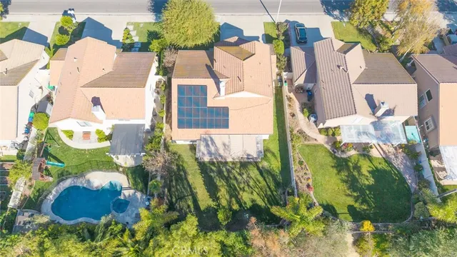 an aerial view of residential houses with outdoor space
