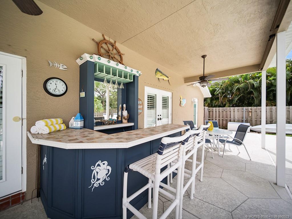 2498 Southeast Springtree Place Stuart, FL 34997 - Photo 19 of 25 a dining hall with furniture and window