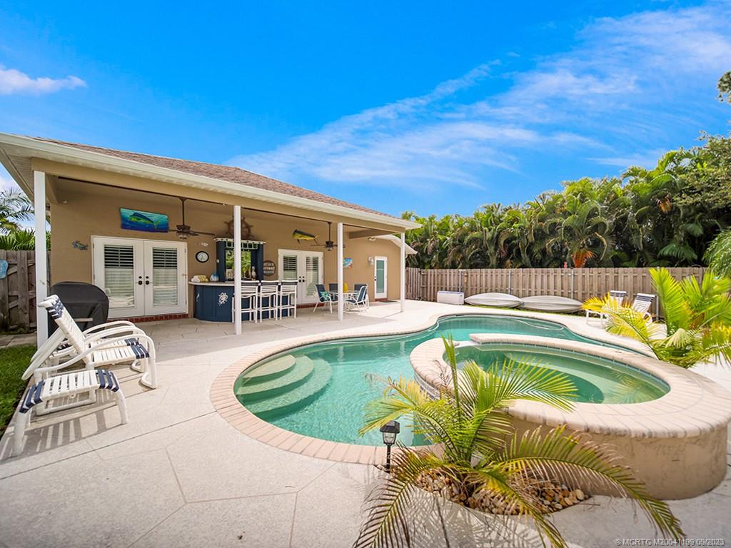 2498 Southeast Springtree Place Stuart, FL 34997 - Photo 20 of 25 a view of swimming pool with seating space
