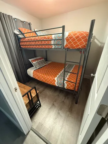 a view of staircase with lots of wooden floor and windows