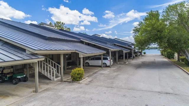 a bedroom with a bed and a ceiling fan