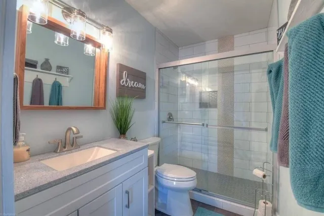 a view of a lake with houses in the back