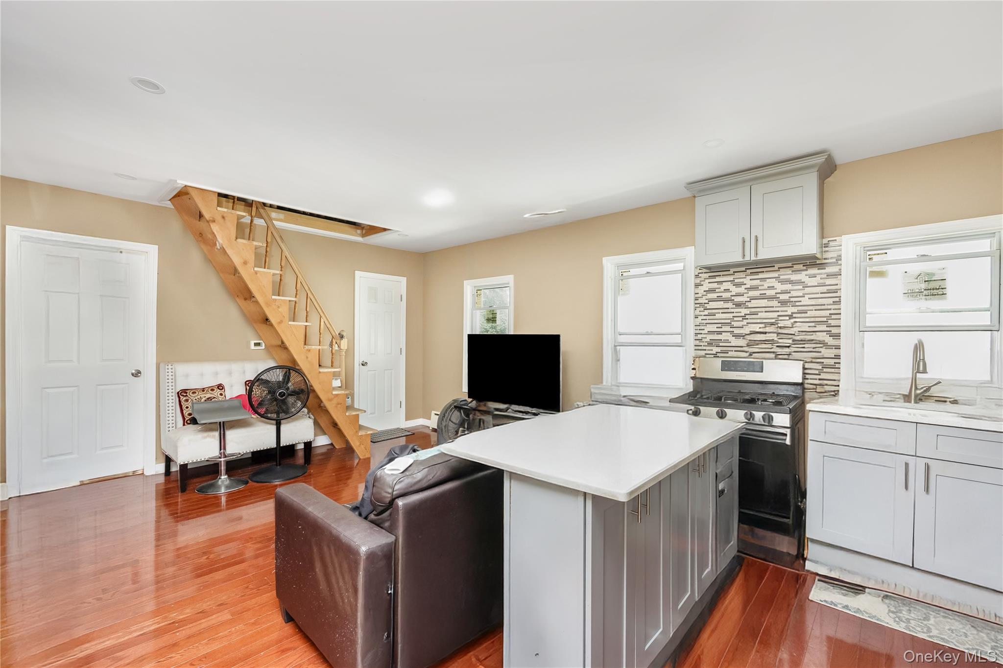 102-18 216th Street Queens, NY 11429 - Photo 23 of 23 a view of kitchen with sink microwave and refrigerator