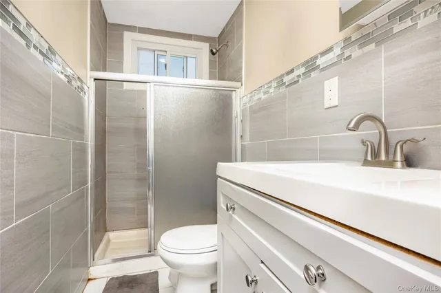 a large kitchen with kitchen island a sink table and chairs