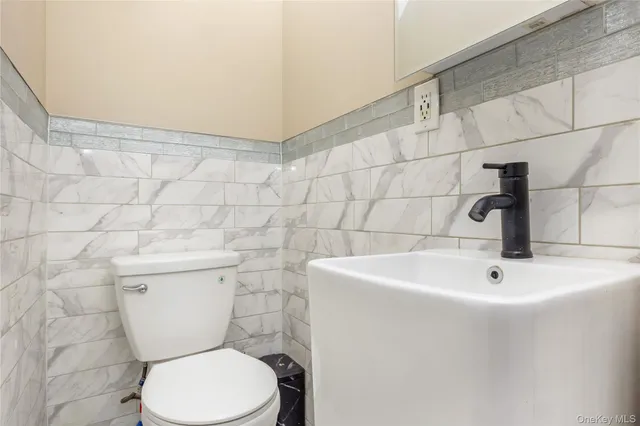 a view of kitchen with sink microwave and refrigerator