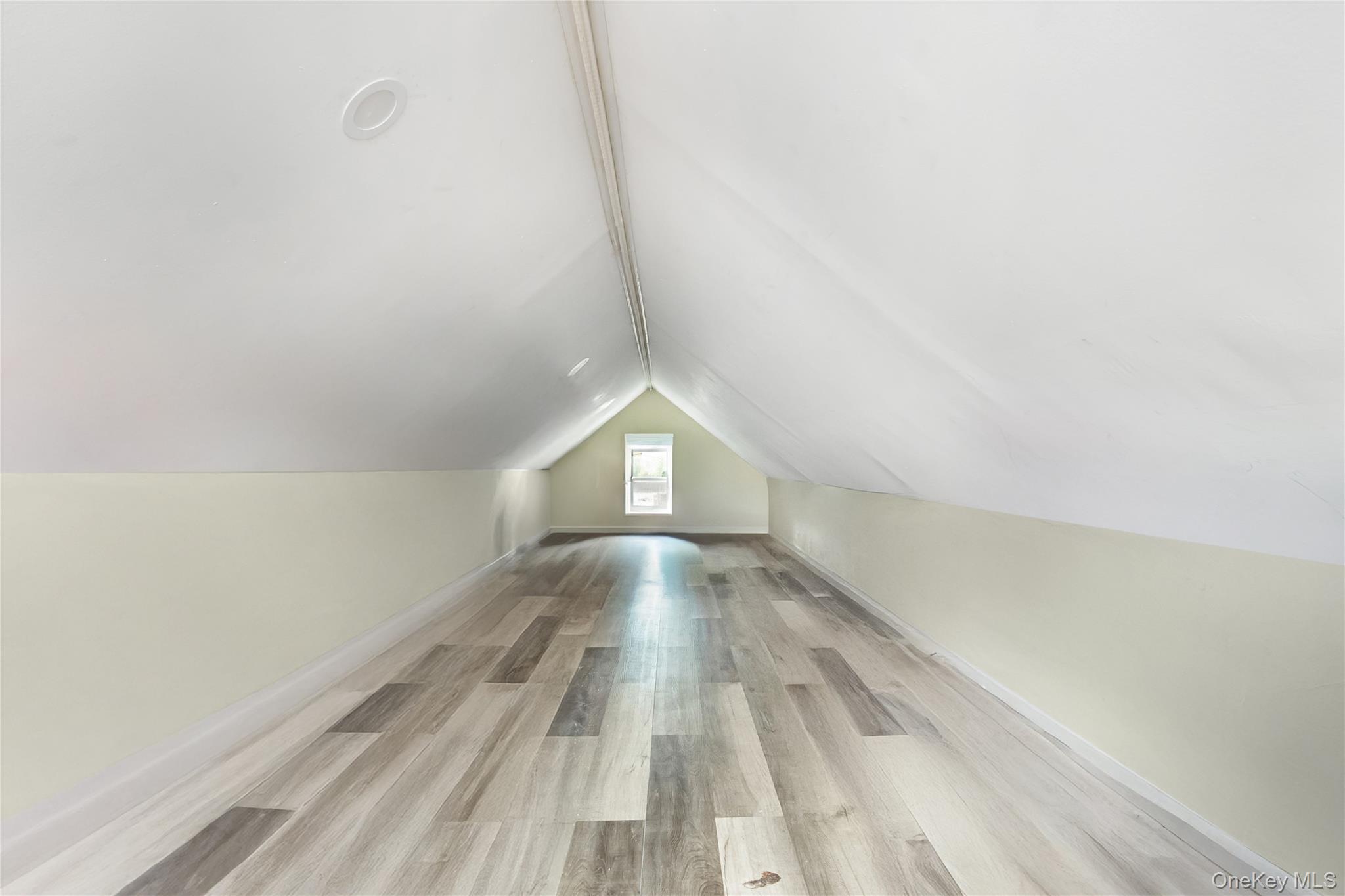 102-18 216th Street Queens, NY 11429 - Photo 17 of 23 a view of empty room with wooden floor and fan