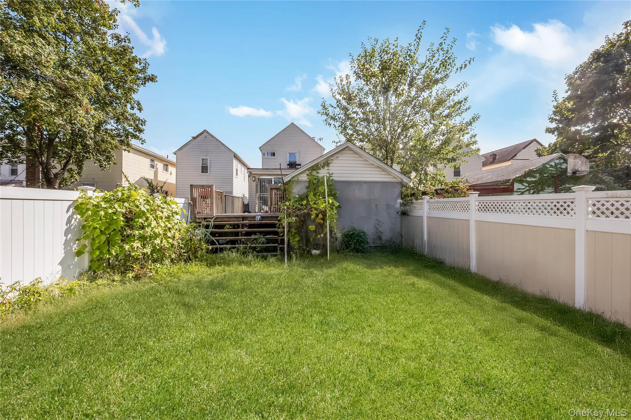 102-18 216th Street Queens, NY 11429 - Photo 20 of 23 a view of a house with a yard