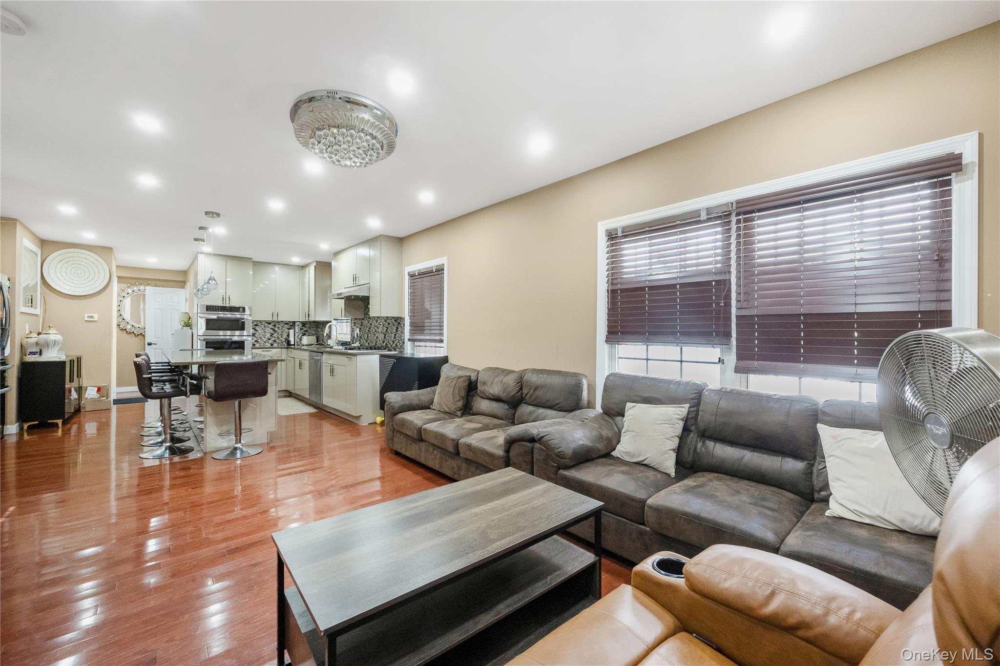 102-18 216th Street Queens, NY 11429 - Photo 4 of 23 a living room with furniture and a large window