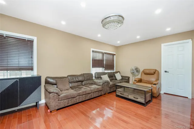 a living room with furniture window and wooden floor