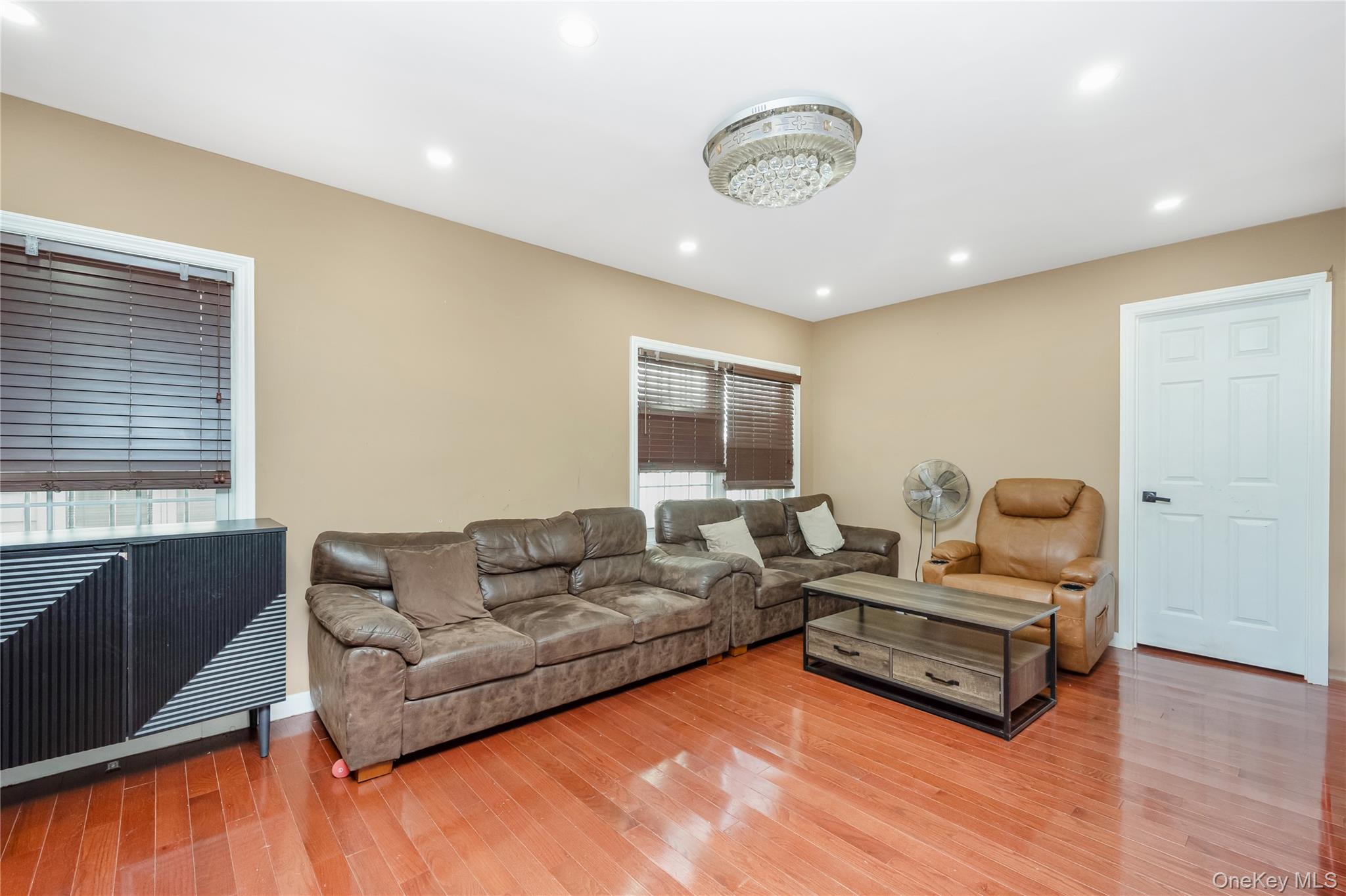 102-18 216th Street Queens, NY 11429 - Photo 5 of 23 a living room with furniture window and wooden floor