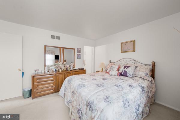 3413 Retlaw Road Baltimore, MD 21207 - Photo 16 of 32 Serene bedroom with floral accents.