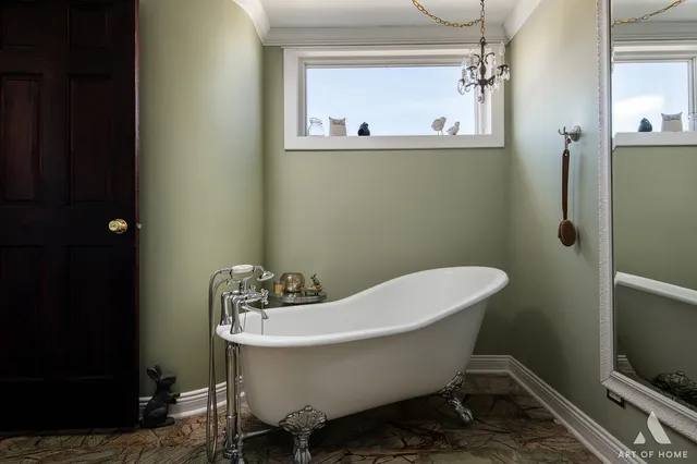 a bathroom with a sink and mirror with toilet