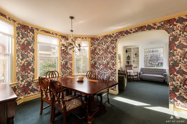 a view of a dining room with furniture and window
