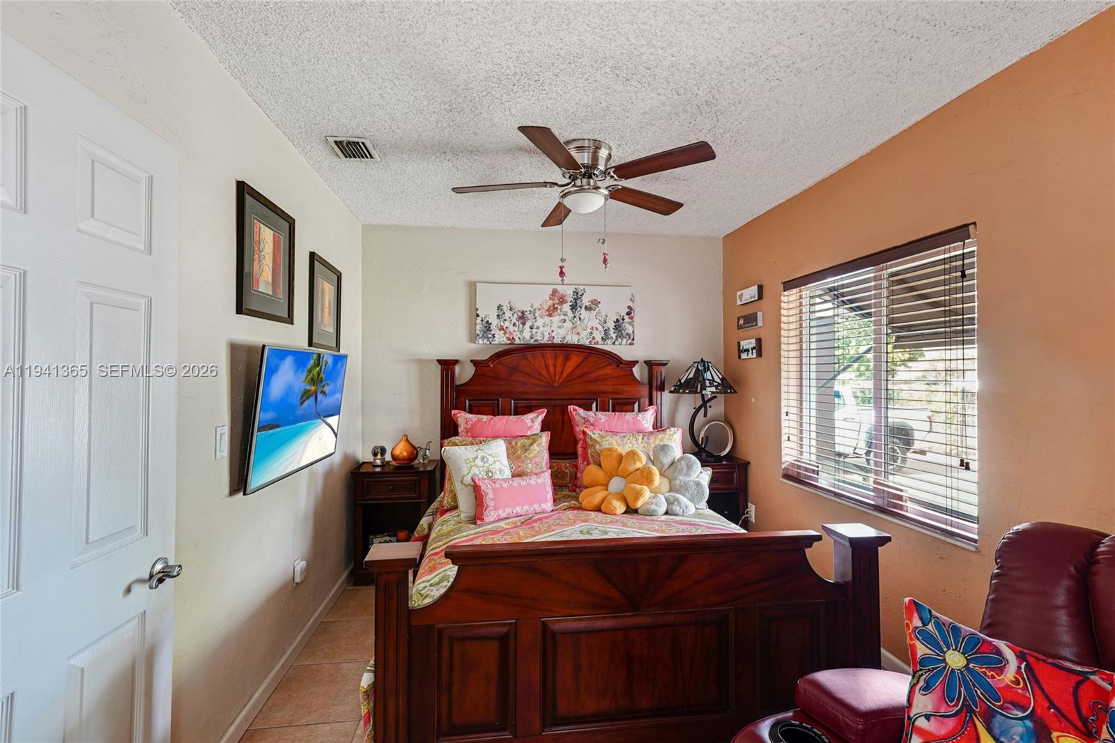 7256 Southwest 16th Street Miami, FL 33155 - Photo 17 of 25 a bed room with furniture and a window