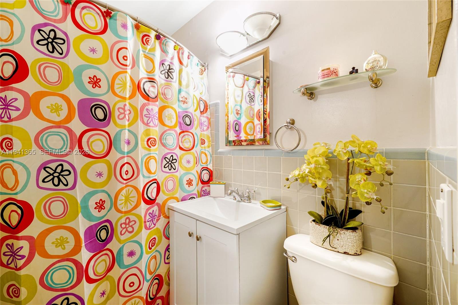 7256 Southwest 16th Street Miami, FL 33155 - Photo 19 of 25 a bathroom with a sink mirror vanity and toilet