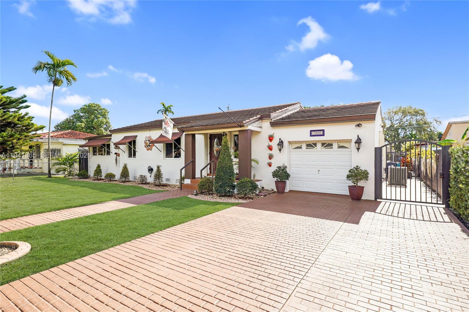 7256 Southwest 16th Street Miami, FL 33155 - Photo 2 of 25 a view of a house with a yard