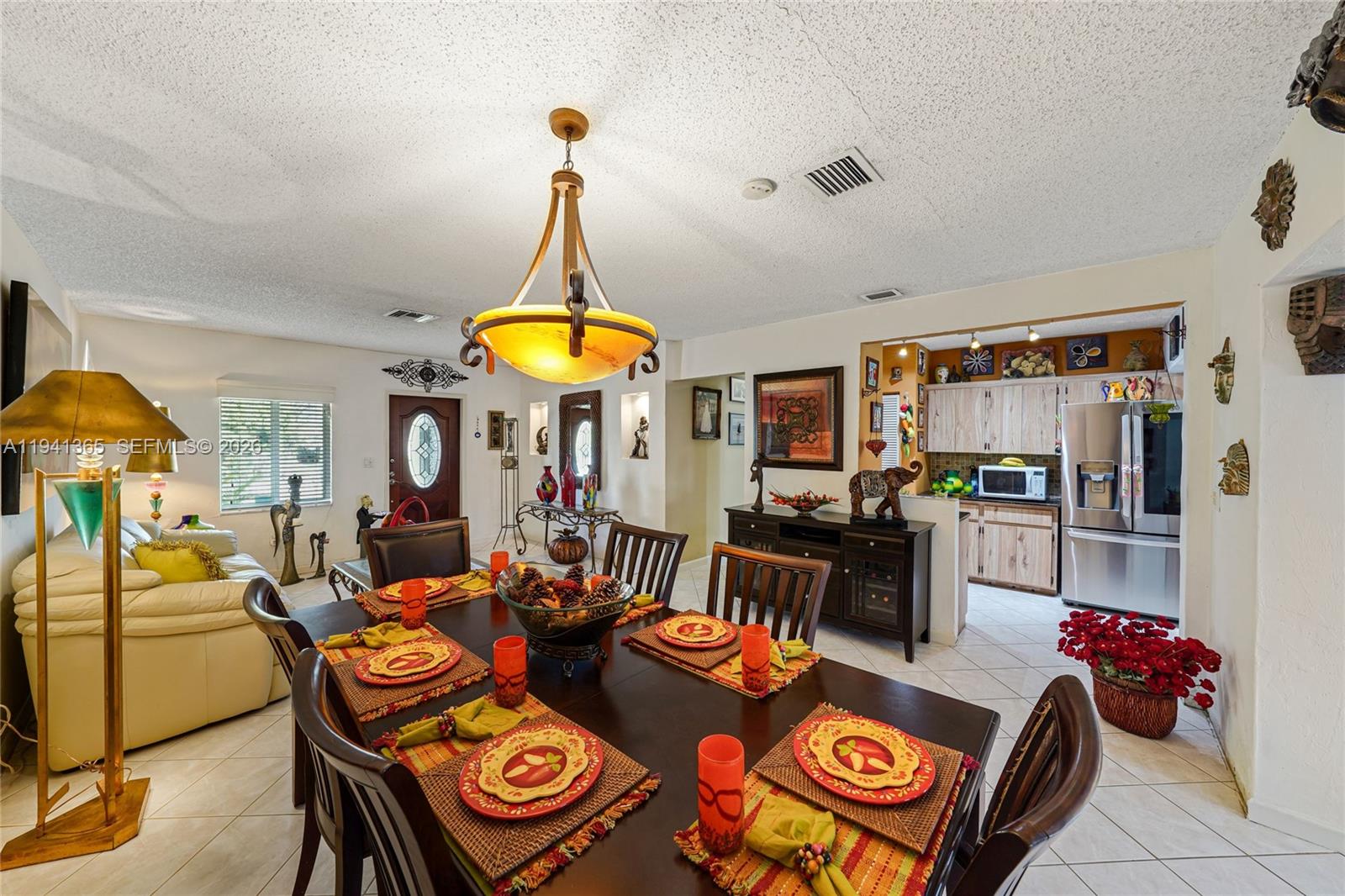 7256 Southwest 16th Street Miami, FL 33155 - Photo 6 of 25 a view of a dining room with furniture one side kitchen view and wooden floor