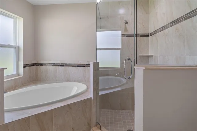 a bathroom with a shower and a shower