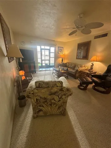 a bed room with a bed couch and a window