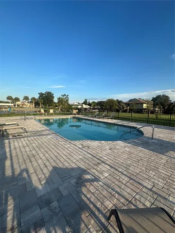 a view of swimming pool with a yard
