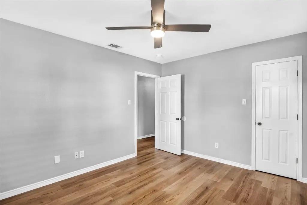 1915 Shaw Street Dallas, TX 75212 - Photo 15 of 34 wooden floor in an empty room