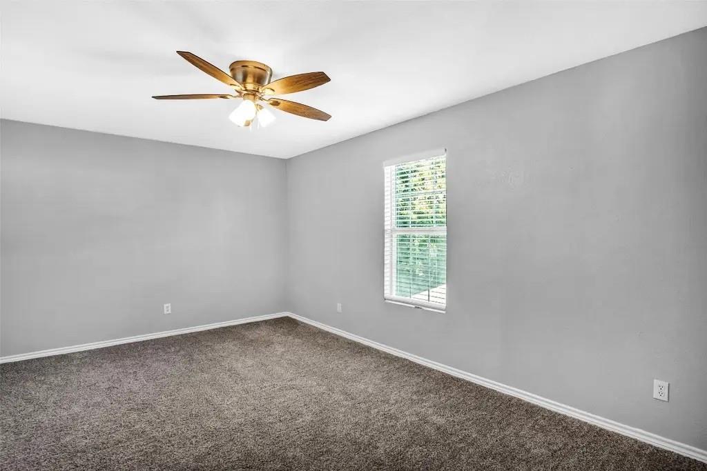 1915 Shaw Street Dallas, TX 75212 - Photo 22 of 34 an empty room with windows and fan