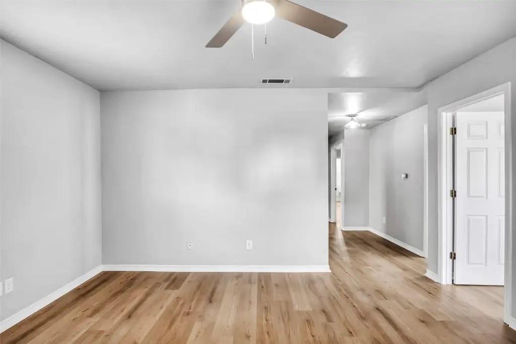 1915 Shaw Street Dallas, TX 75212 - Photo 25 of 34 wooden floor in an empty room with a window