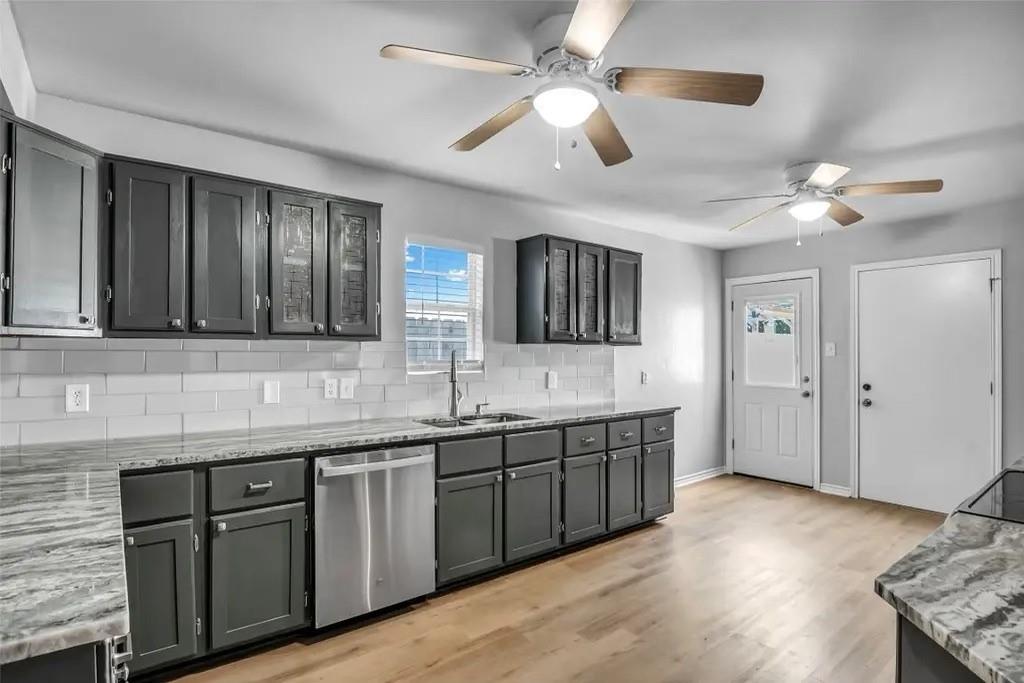 1915 Shaw Street Dallas, TX 75212 - Photo 7 of 34 a spacious bathroom with a granite countertop sink and a large mirror