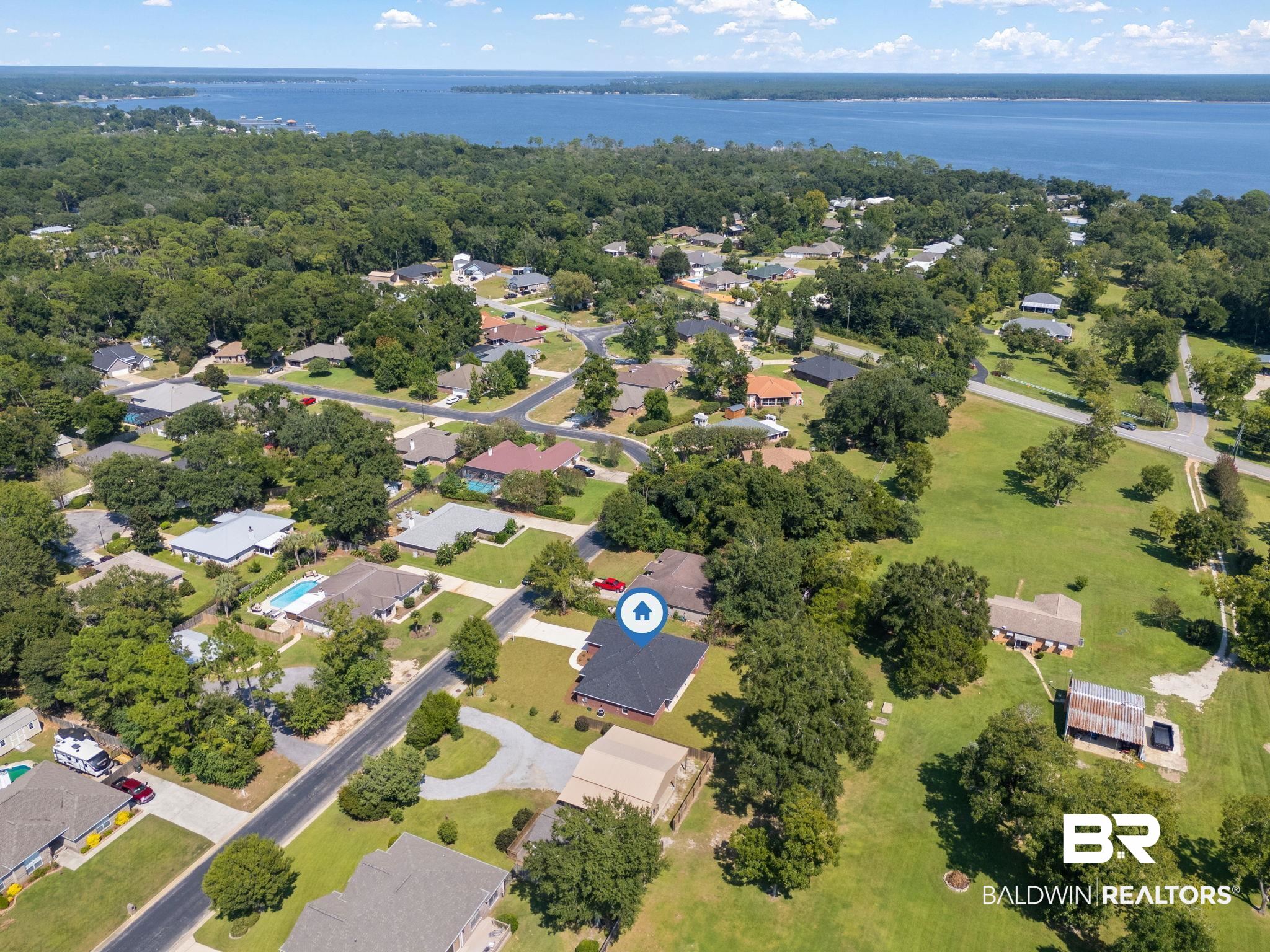 32563 Arbor Ridge Circle Lillian, AL 36549 - Photo 51 of 53 Aerial view of residential area with a nearby body of water