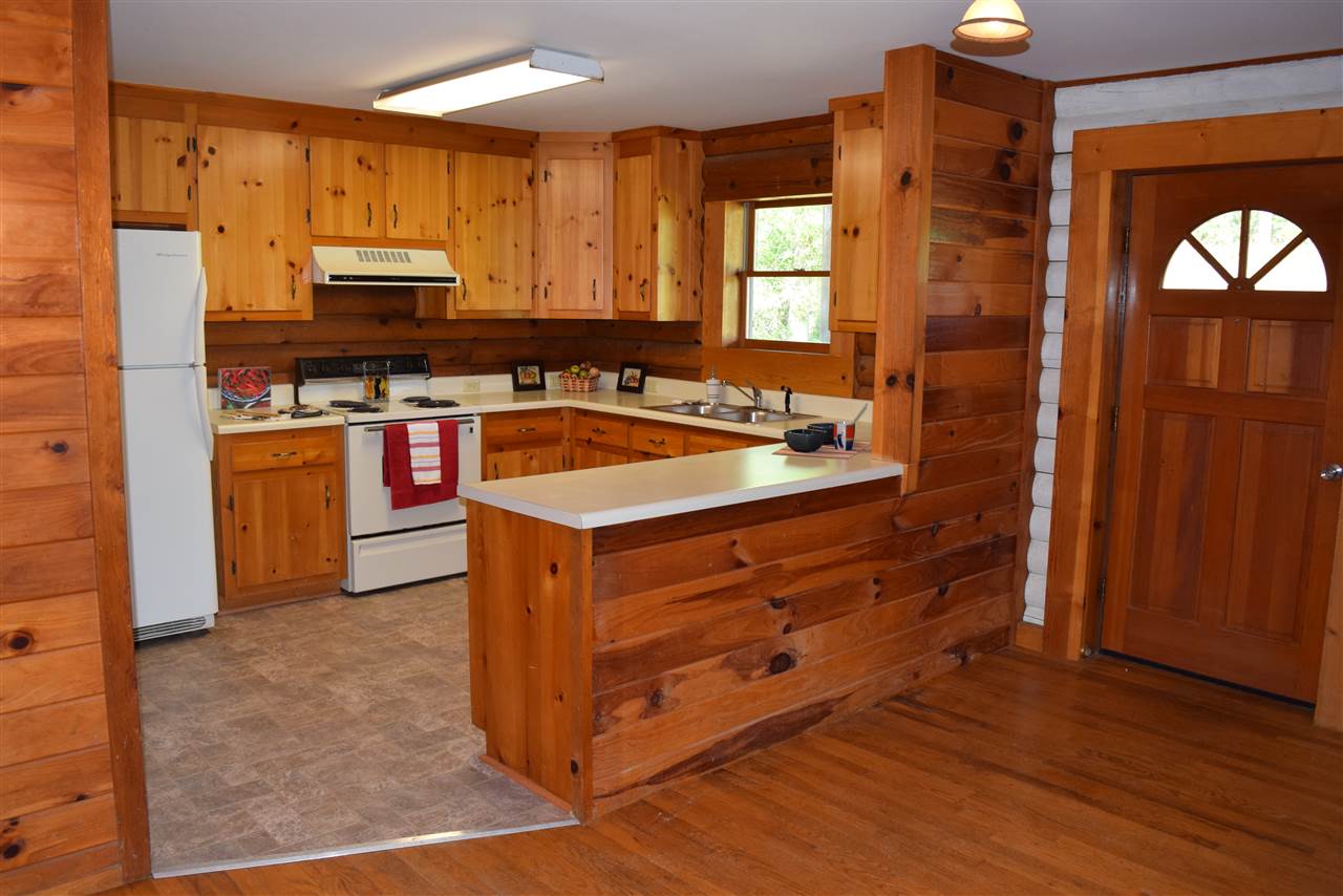 382 McKamy Springs Road Middlebrook, VA 24459 - Photo 14 of 48 a kitchen with stainless steel appliances granite countertop a stove a sink and a refrigerator