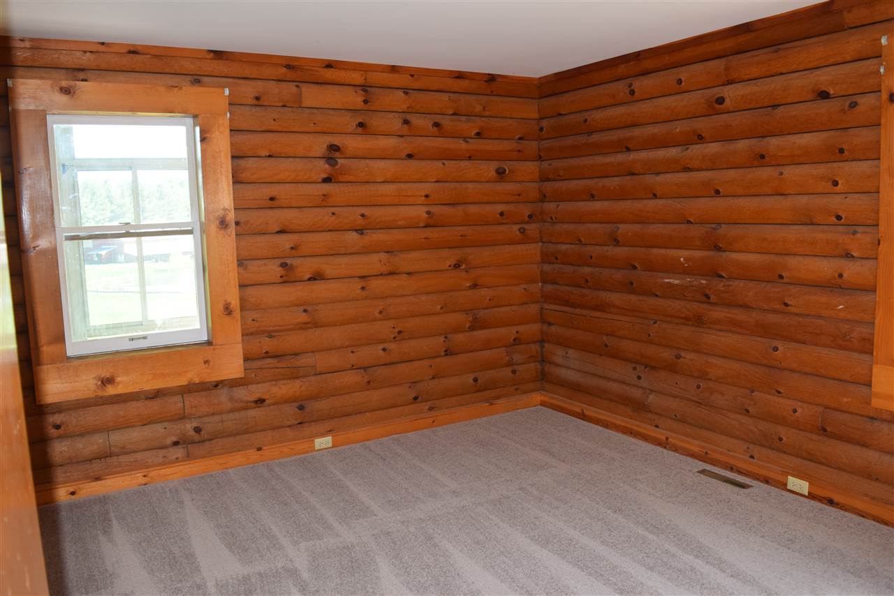 382 McKamy Springs Road Middlebrook, VA 24459 - Photo 18 of 48 a view of empty room with window and wooden floor