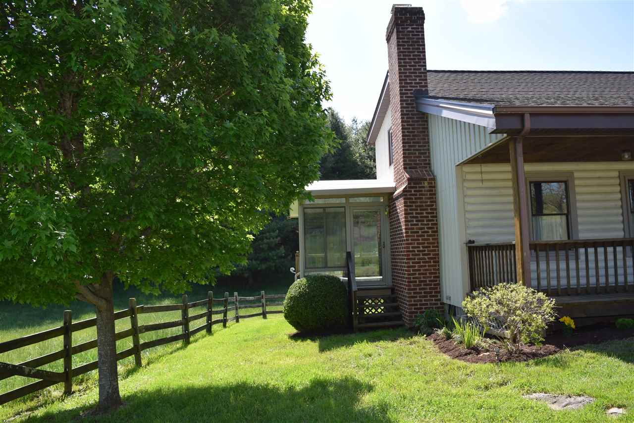 382 McKamy Springs Road Middlebrook, VA 24459 - Photo 8 of 48 a backyard of a house with table and chairs