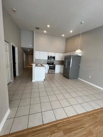 a view of an empty room and a window